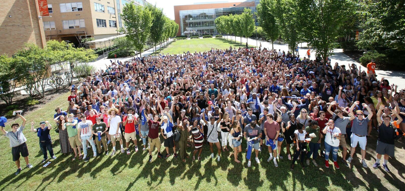 2018 Salem State Freshman class gather on a greenspace on campus