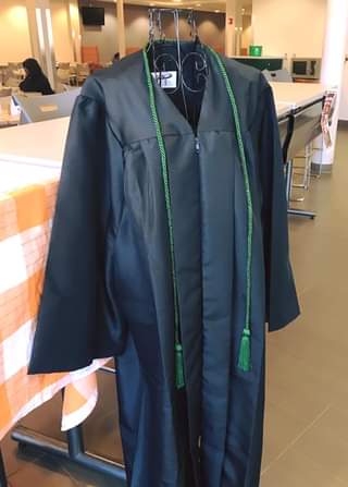 gown with green cord